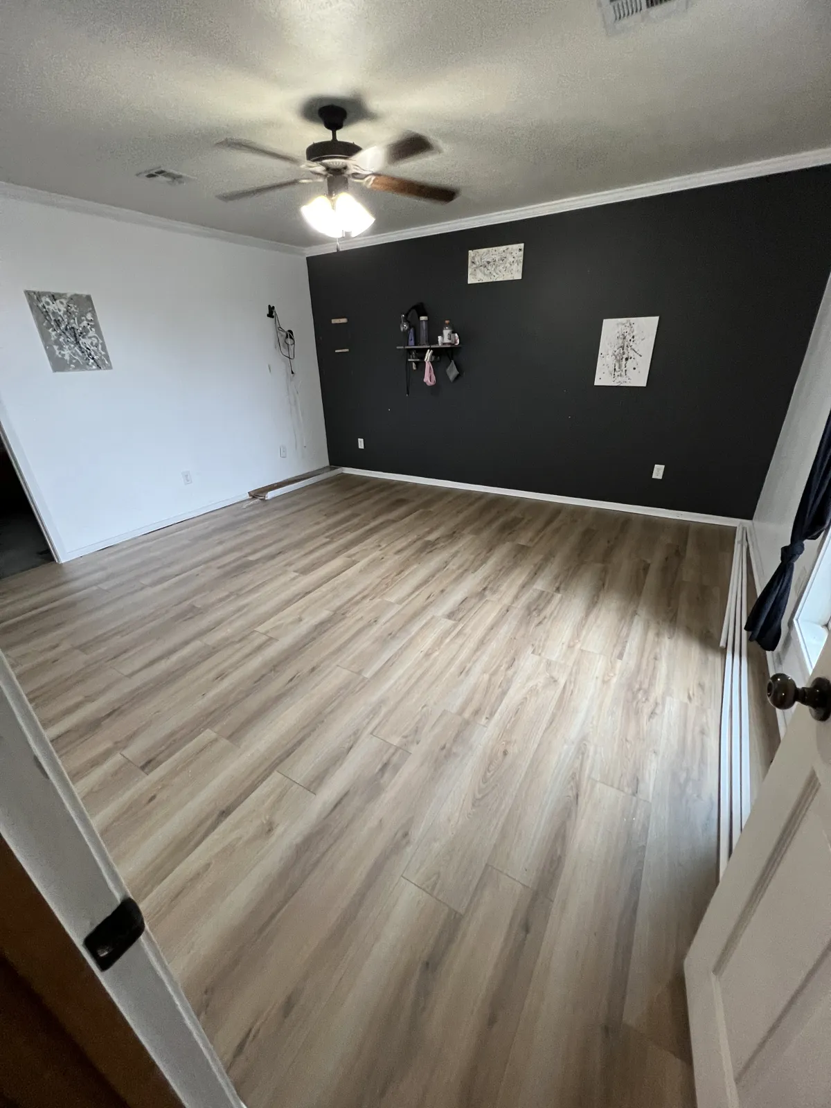 Room with newly installed plank flooring
